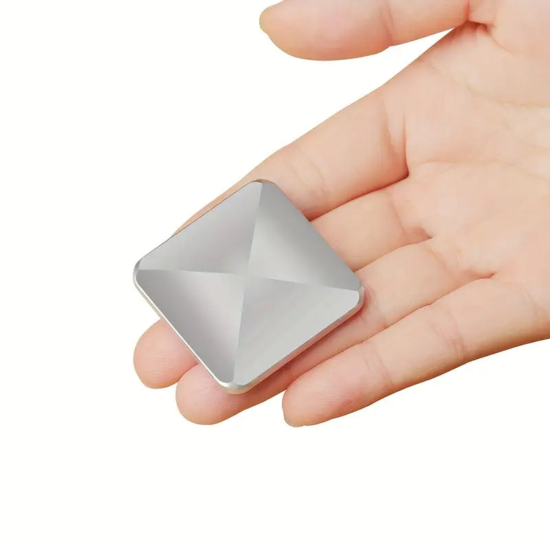 Silver square fidget flip toy in hand